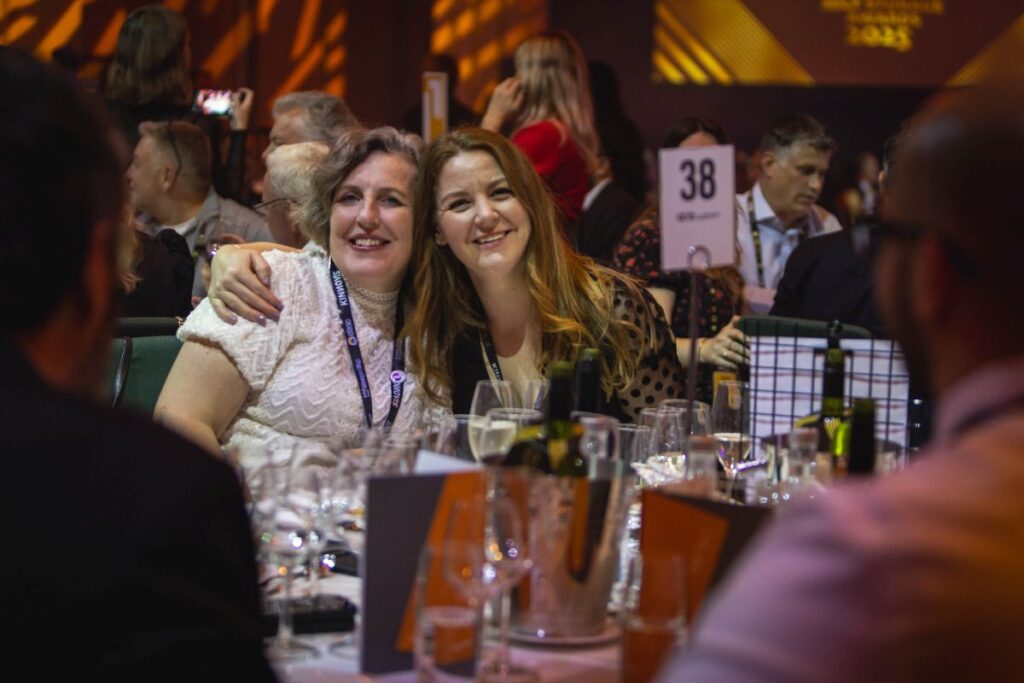 Two Friends Enjoying Dinner During Gala At Fedesa Event - E17