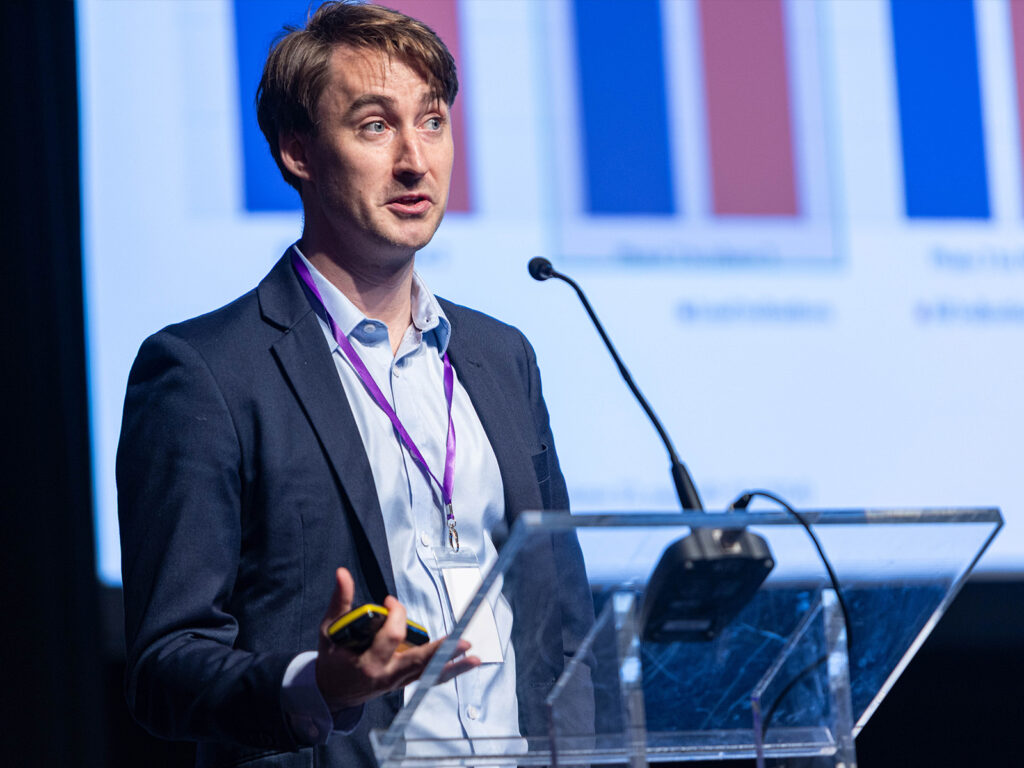 Conference photography Dublin showing speaker and audience at corporate event in dublin ireland. rds hall 