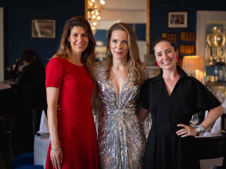 Three guests in evening dresses at a birthday celebration in Dublin