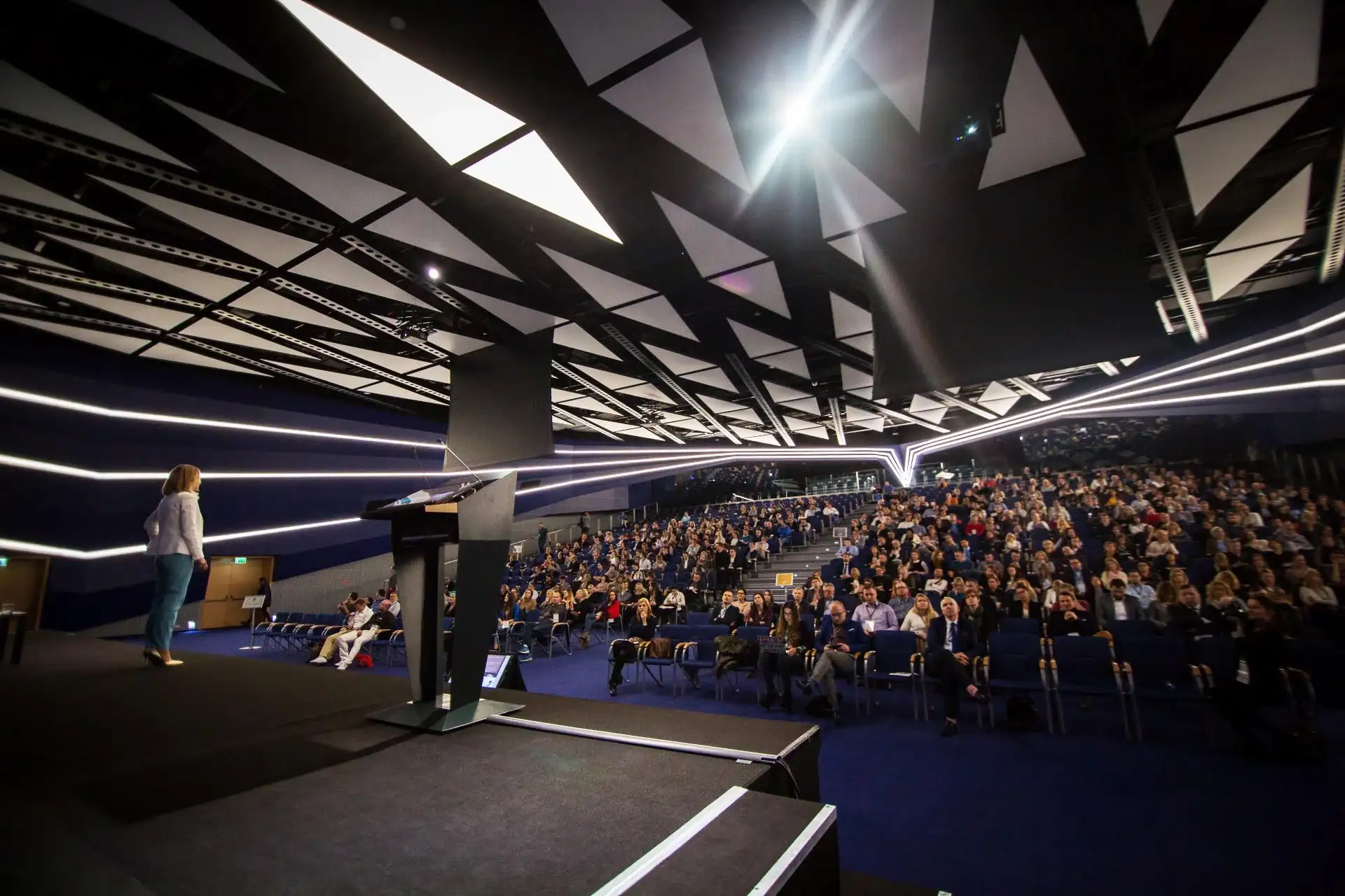 Conference photographer Dublin – speaker presenting on stage to a full auditorium
