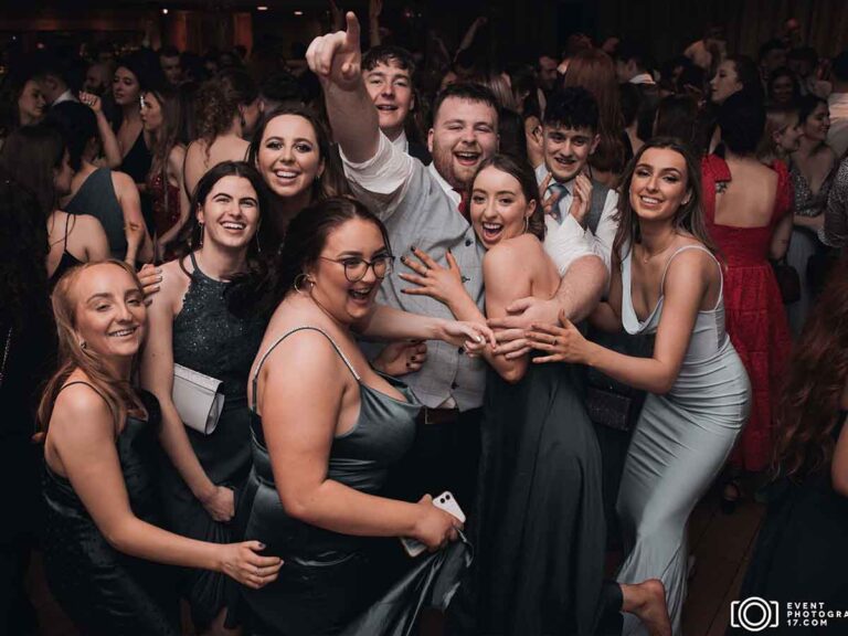 Group of friends celebrating together on the dance floor at a night party in Dublin