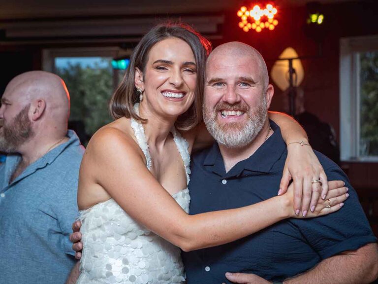 Couple hugging and smiling at a private celebration in Dublin